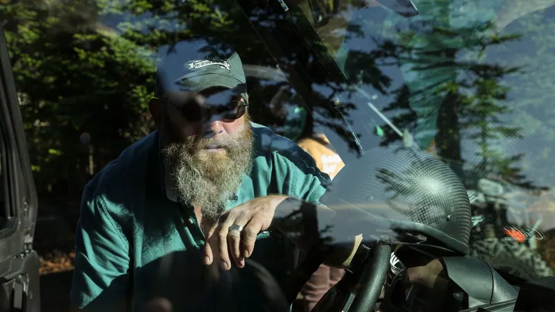 Bearded driver at the wheel of an off-road vehicle