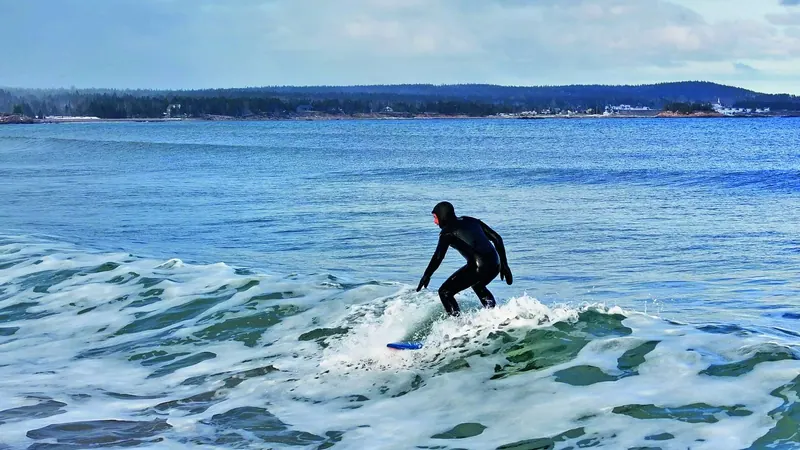 Surfer riding a breaking wave