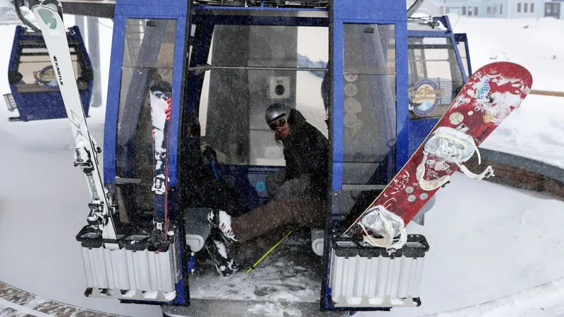 Skier and snowboard racks on a gondola cabin in winter
