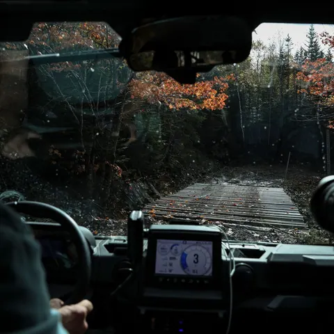 Driver’s view from an off-road vehicle on a muddy forest track