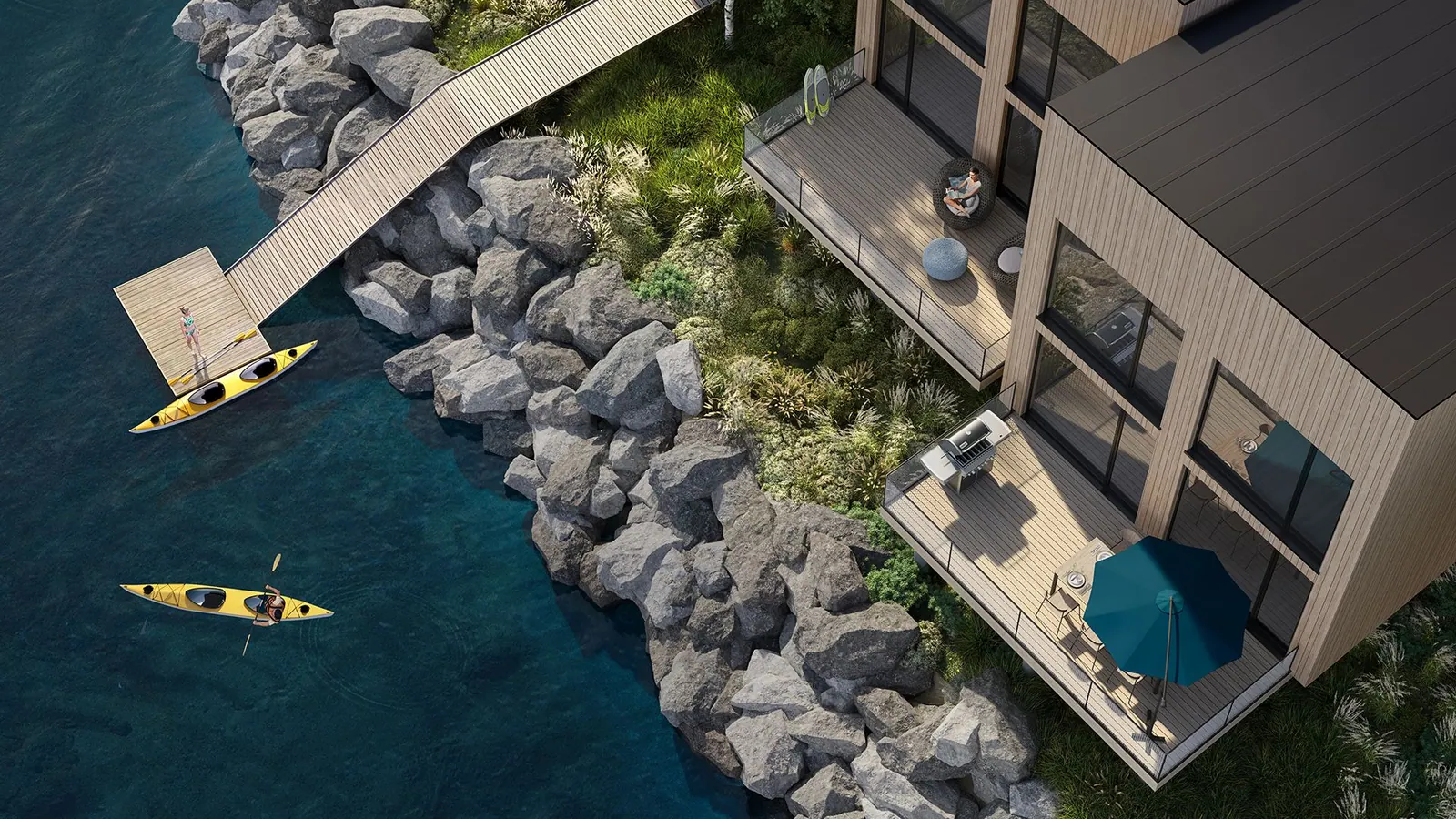Aerial view of chalet terraces and kayaks on the water at Cormorant Rock