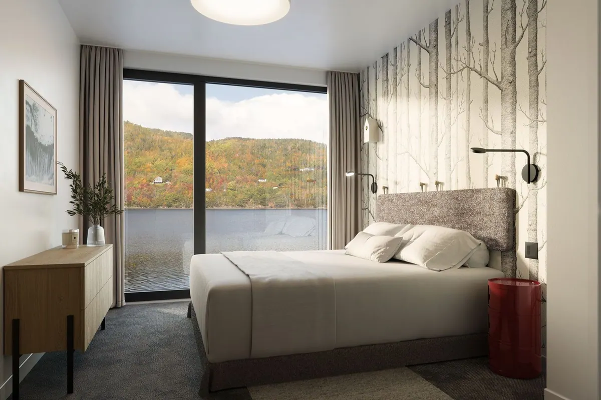 Bedroom with green accents and oak wardrobes