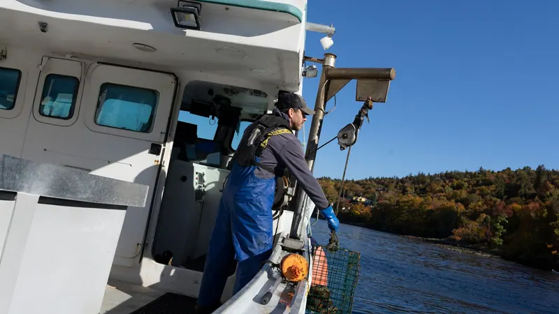 Fisherman working on the deck of a lobster boat