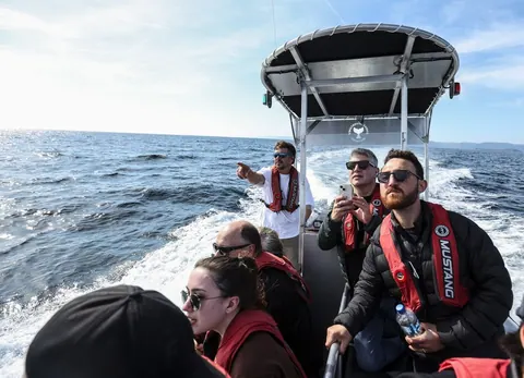 Guests on a boat excursion along the coast