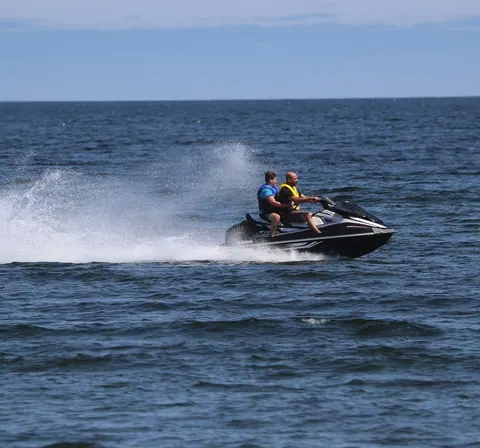 Jet ski speeding across the bay