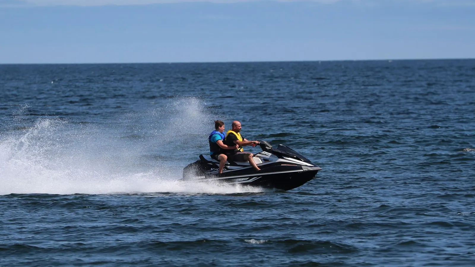Jet ski speeding across the bay