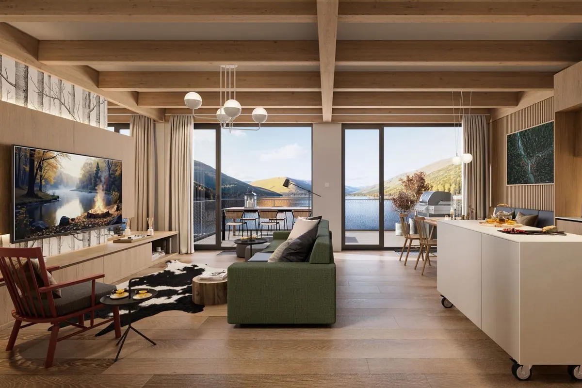 Living room with large windows onto the water