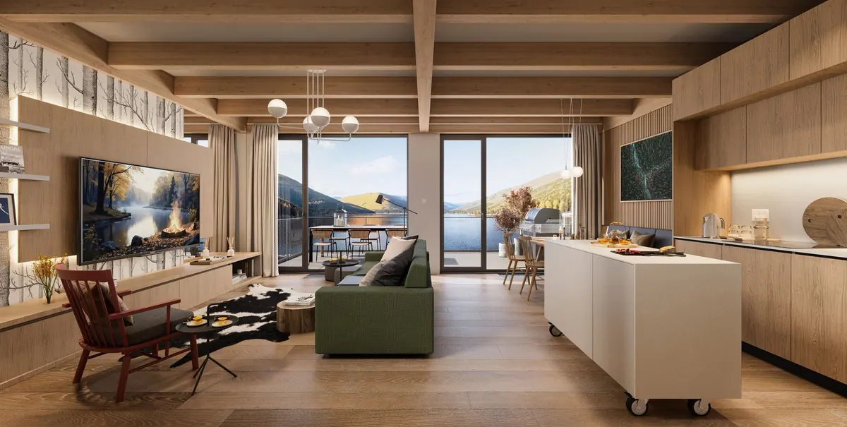 Open-plan living room and kitchen with timber walls, sofa and dining table for six
