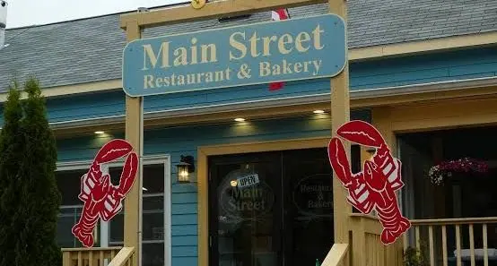 Main Street Restaurant &amp; Bakery sign with painted lobsters at the entrance