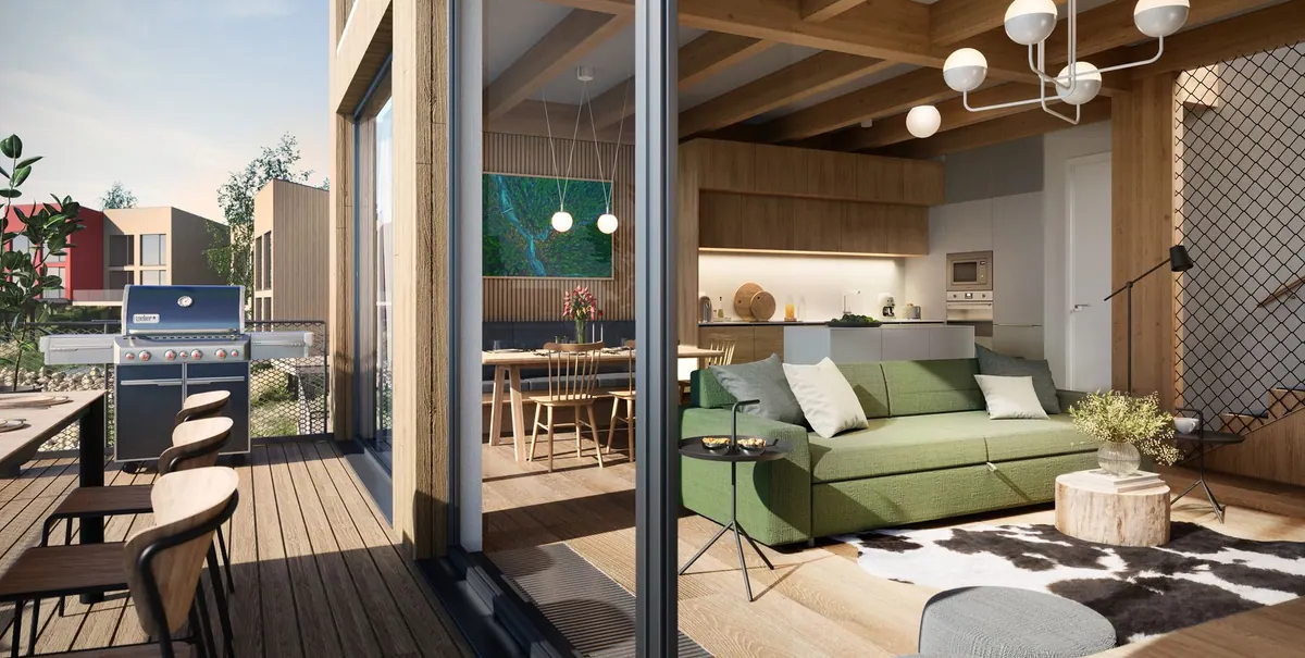 Chalet terrace with dining table and designer chairs overlooking the bay