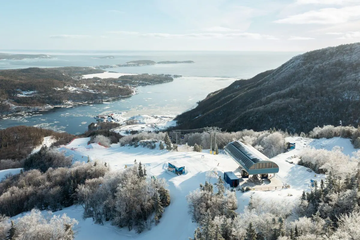 Frosted forest and the gondola station on the Cape Smokey summit above the Atlantic coast