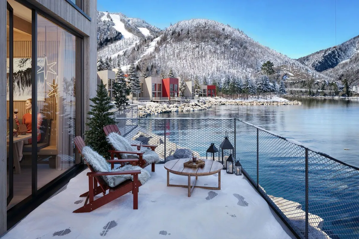 Chalet terrace in winter with snow on the railing