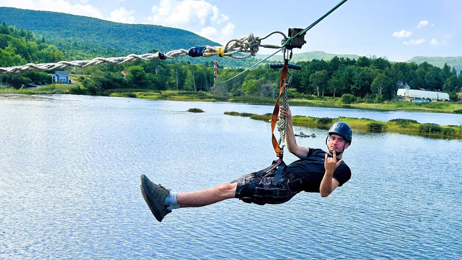 Zipline rider above the treetops of Cape Breton